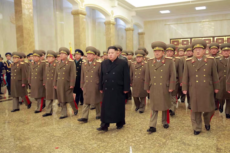 Image: North Korean leader Kim Jong-Un is accompanied by commanding officers of the Korean People's Army