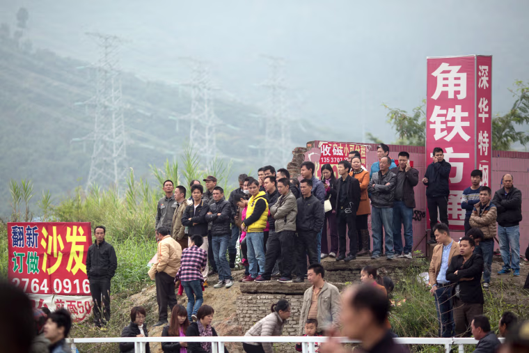 Image: China ramps up search for survivors a day after deadly landslide