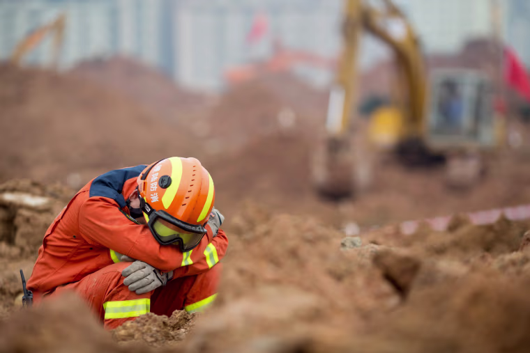 Image: China ramps up search for survivors a day after deadly landslide