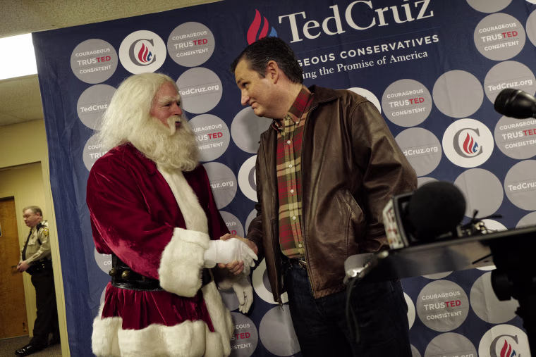 Republican presidential candidate Senator Ted Cruz holds a press availability at the Life Church on December 18, 2015 in Mechanicsville, Virginia. He was joined by a local man named Robin Hood (63) dressed at Santa Claus. (Photos by Charles Ommanney/The Washington Post via Getty Images)