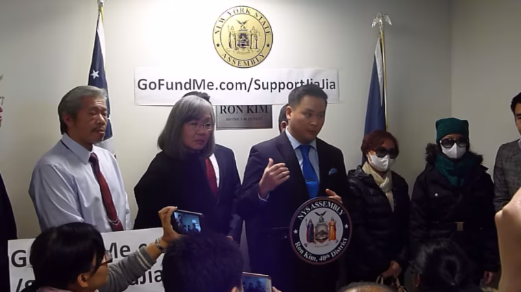 New York state Assemblyman Ron Kim announcing a fundraiser to support Jia Jia Liang (far right), who was slashed in the neck and face while walking from school in Queens.