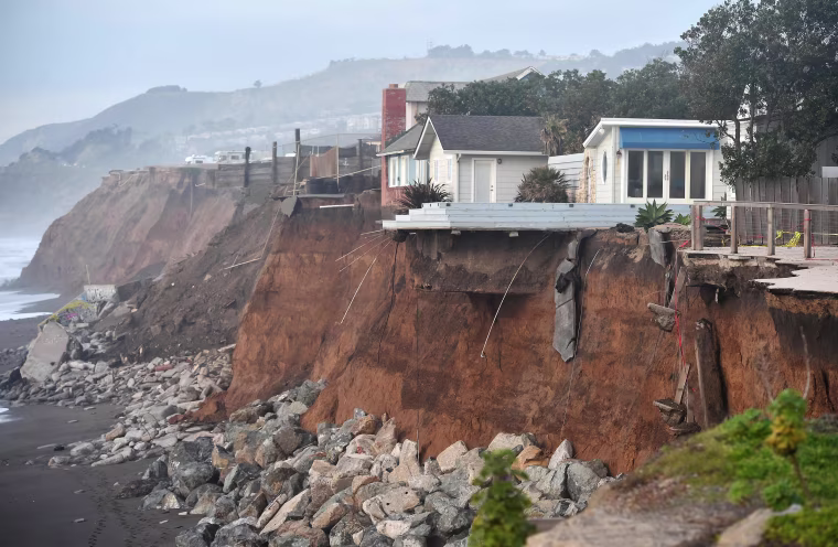 Image: Sections of land are seen missing from coastal properties in Pacifica