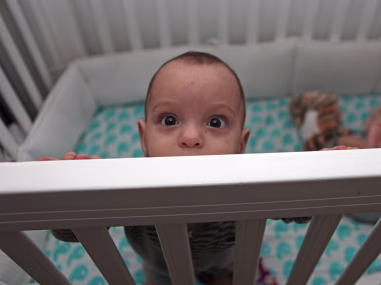 Baby in a crib.