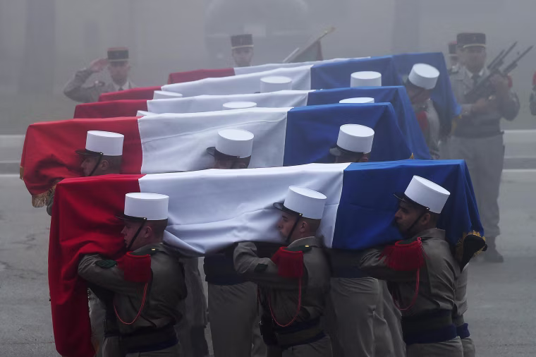 Image: Soldiers carry the coffins of the six French Foreign Legionnaires who died following an avalanche in the Alps
