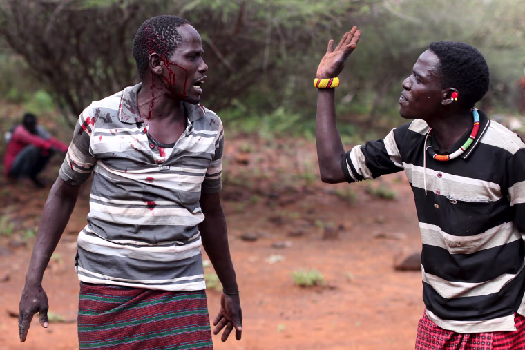 Image: Two men fight over a dispute during an ceremony