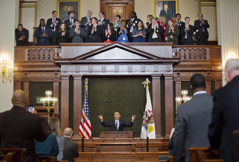 Image: President Barack Obama receives a standing ovation before addressing the Illinois General Assembly