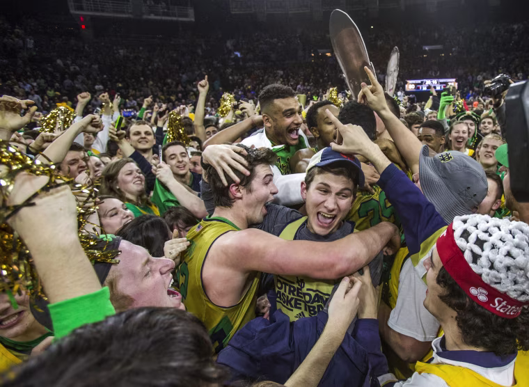 Image: Notre Dame’s Steve Vasturia celebrates on the court with fans