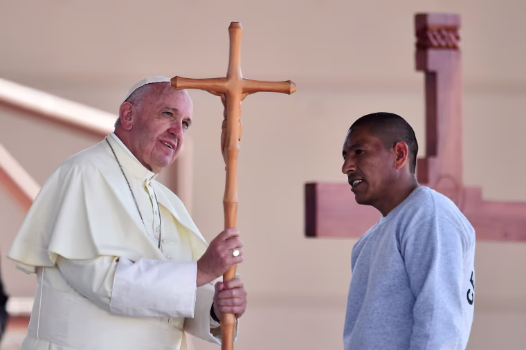 Image: Pope Francis receives a cross made by an inmate during his visit to the CeReSo n. 3 penitentiary