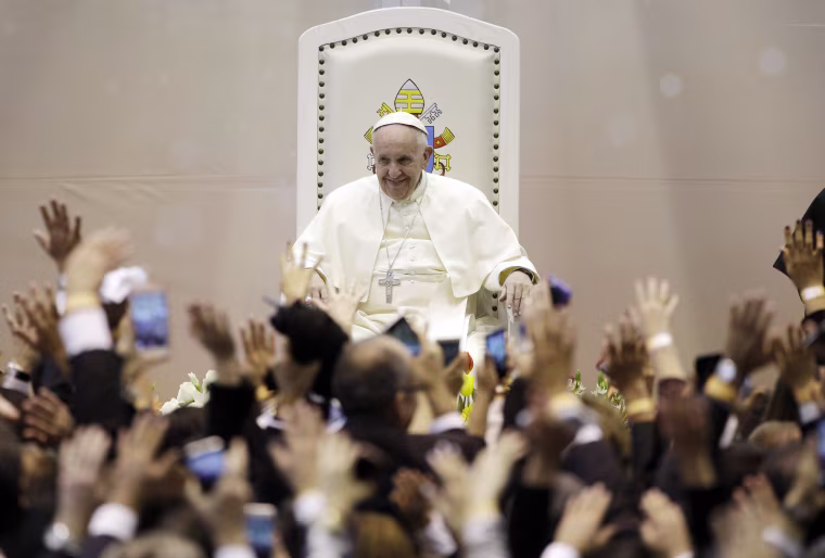 Image: Pope Francis smiles as members of the World of Work organization wave at him in Ciudad Juarez