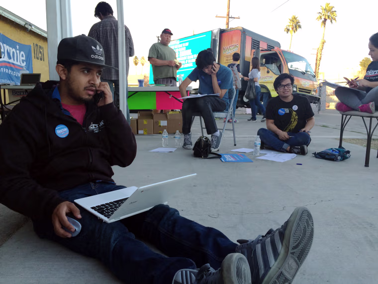 Austreberto Hernandez, of Las Vegas, makes get out to caucus calls for Bernie Sanders.