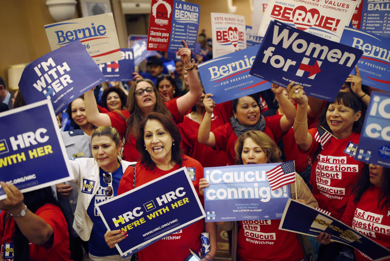 Image: Supporters of Hillary Clinton and Bernie Sanders cheer on their presidential candidates
