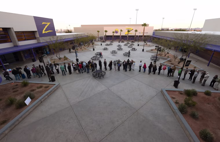 Image: Voters line up to vote at a local high school