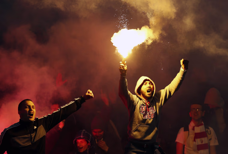 Image: Red Star soccer fans cheer during a Serbian National soccer league derby match
