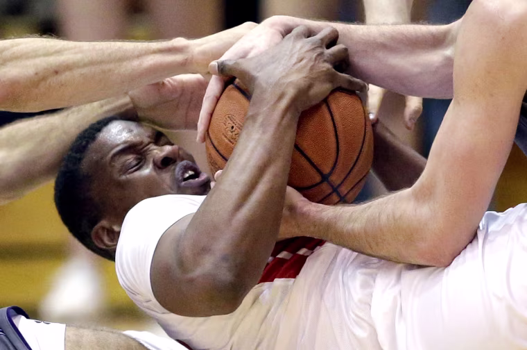 Image: Rutgers forward/center Ibrahima Diallo battles for a loose ball against Northwestern guard Tre Demps