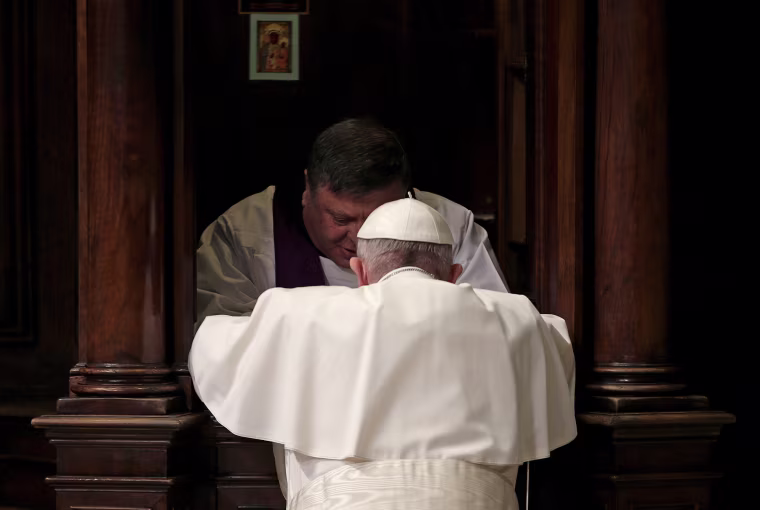 Pope Francis confesses as he leads a penitential service in Saint Peter's Basilica at the Vatican.