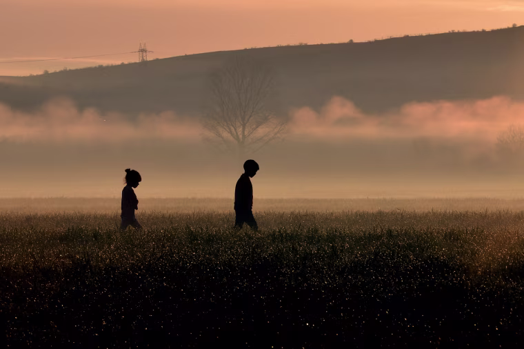 Children walk through a field near a makeshift camp near the Greek village of Idomeni, where thousands of migrants and refugees are stranded along the border with Macedonia. As the diplomatic efforts went into high gear ahead of a March 7 summit between the EU and Turkey, the human misery along the Greek-Macedonia border worsened after a night of driving rain and plummeting temperatures. The humanitarian crisis is particularly acute at the Idomeni crossing where around 12,000 people are stranded after Austria and the Balkan states imposed a cap on entries, triggering a rapidly-growing buildup in Greece.