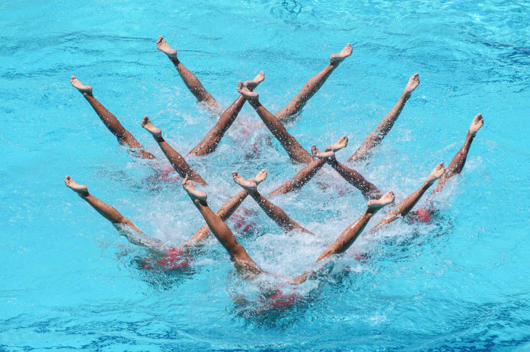 Image: The synchronized swimming team of Japan performs during the teams' free routine final