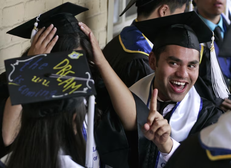 Image: Undocumented UCLA students attend a graduation ceremony at a church near the campus in Los Angeles
