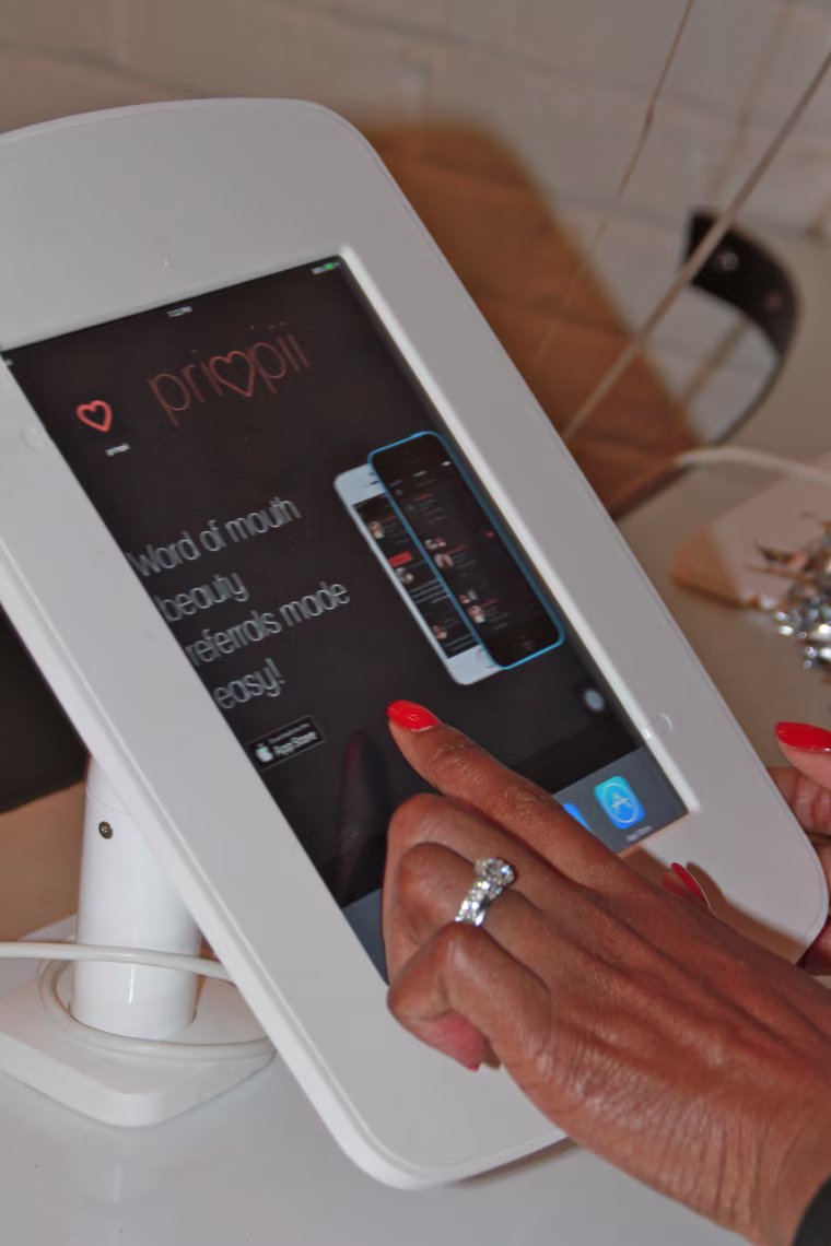 An iPad display of the beauty-sharing app, Primpii - founded by Tausha Robertson.