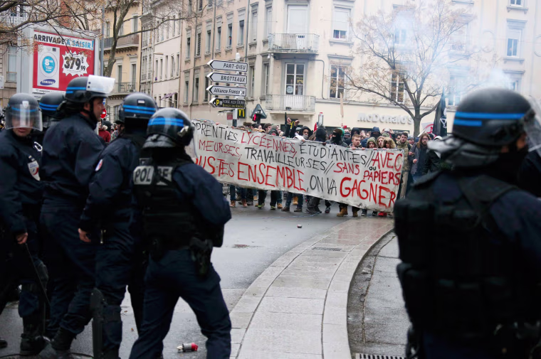 Image: Students and workers face off with French police during a demonstration against the French labour law proposal in Lyon, France, as part of a nationwide labor reform protest
