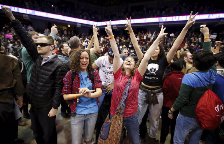 Image: Demonstrators celebrate after Republican U.S. presidential candidate Donald Trump cancelled his rally at the University of Illinois at Chicago