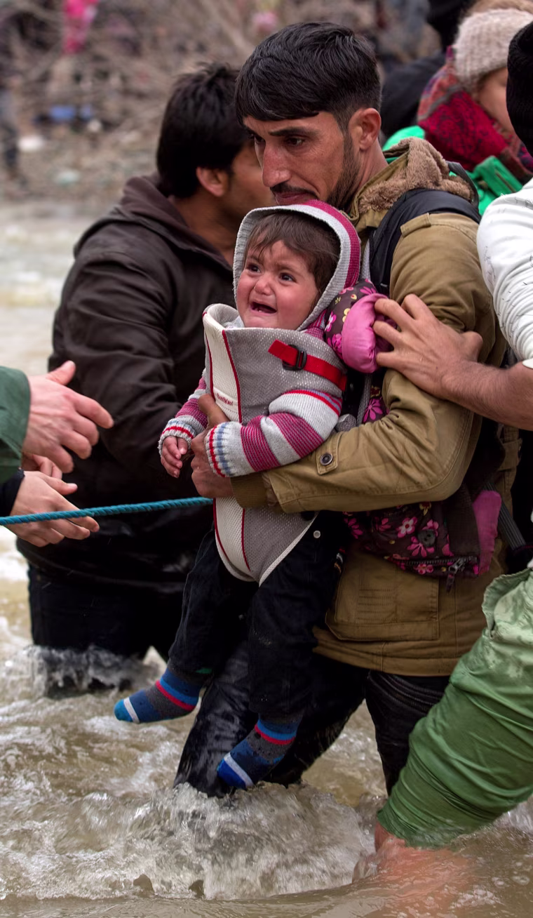 Image: Frustrated Migrants Stranded On The Border Attempt To Walk In To Macedonia