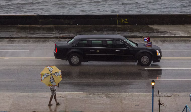 Image: The vehicle carrying President Barack Obama drives along the Malecon sea wall
