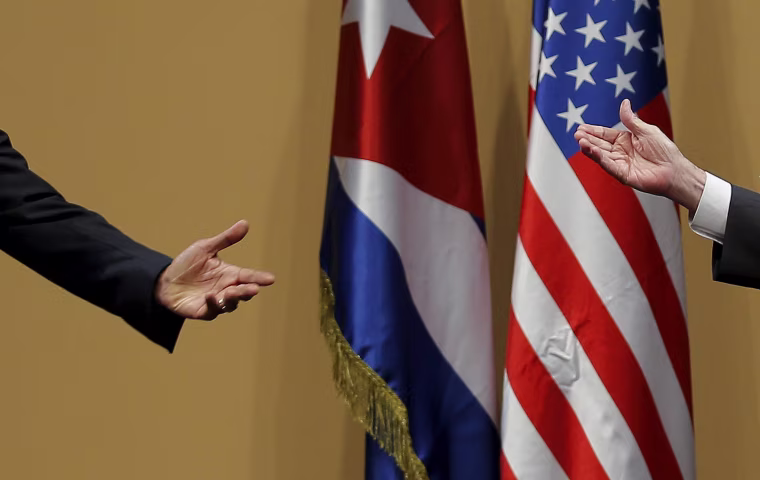 Image: The hands of U.S. President Barack Obama and Cuban President Raul Castro are seen during a news conference as part of Obama's three-day visit to Cuba, in Havana