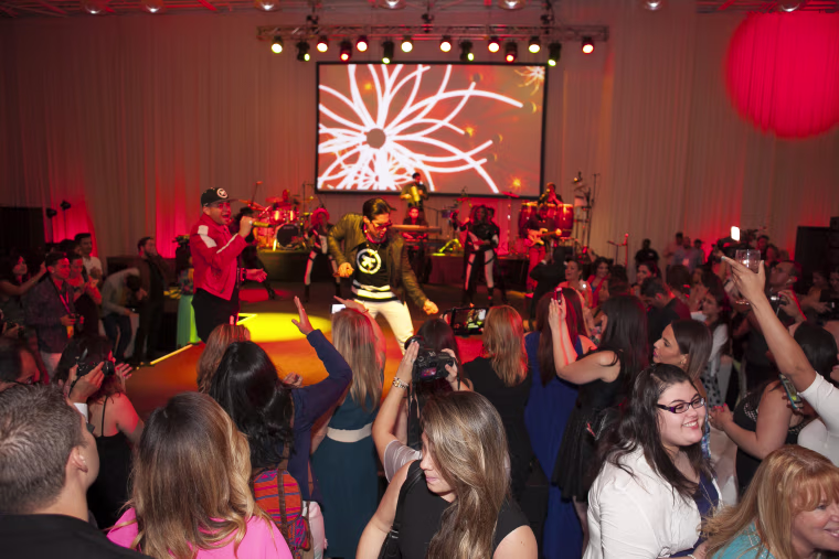 Attendees watching Venezuelan star duo 'Chino y Nacho' perform.