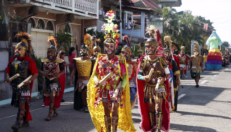 Image: Penitents locally called \"Morions\" wear masks and centurion garbs as they take part in a Good Friday procession as part of Holy Week celebration in Gasan, Marinduque