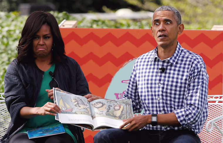 Image: First lady Michelle Obama and President Barack Obama perform a reading of the children's book \"Where the Wild Things Are\" at White House Easter Egg Roll at the White House in Washington