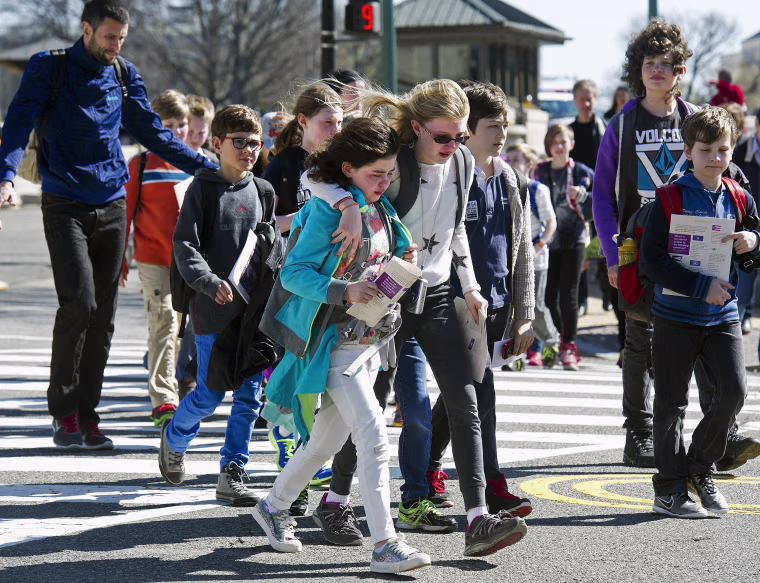 Image: Children are escorted away from the Capitol in Washington