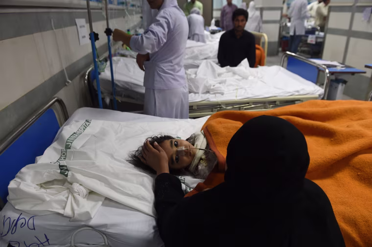 Image: An injured Pakistani child victim of a suicide blast rests in a hospital in Lahore