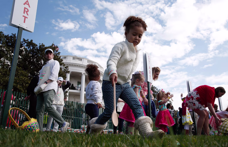 Image: Young children roll Easter eggs on the South Lawn of the White House