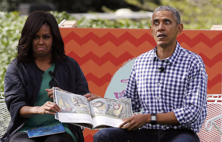 Image: First lady Michelle Obama and President Barack Obama perform a reading of the children's book \"Where the Wild Things Are\" at White House Easter Egg Roll at the White House in Washington