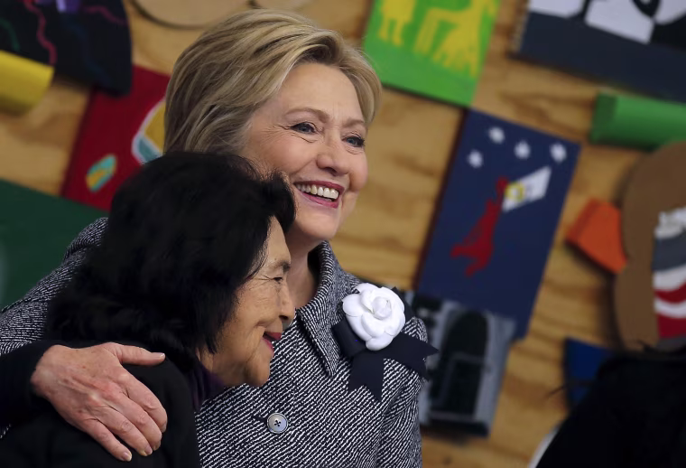 Image: Democratic U.S. Presidential candidate Hillary Clinton embraces Dolores Huerta, a labor leader as she attends a workshop meeting at La Casa The Resurrection Project, a immigrant community center, during a campaign stop in Chicago Illinois