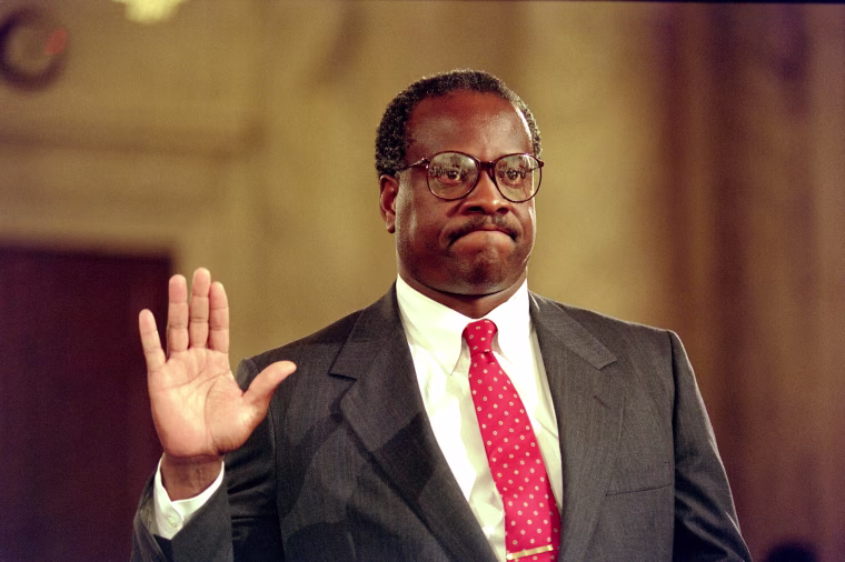 US Supreme Court nominee Clarence Thomas raises his right hand as he is sworn in, 10 September 1991, during confirmation hearings before the US Senate Judiciary Committee, in Washington D.C. U.S. law professor Anita Hill filed sexual harassment charges against US Supreme Court nominee Clarence Thomas.