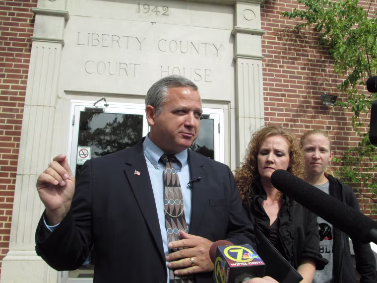 Suspended Liberty County Sheriff Nick Finch talks with reporters on the courthouse steps in Bristol, Fla., on Oct. 31, 2013 after his acquittal on charges of official misconduct and falsifying official records. Finch admitted freeing a concealed weapons suspect who had been frisked in a traffic stop, but said he did so because he believes the Second Amendment gives citizens a legal right to bear arms.