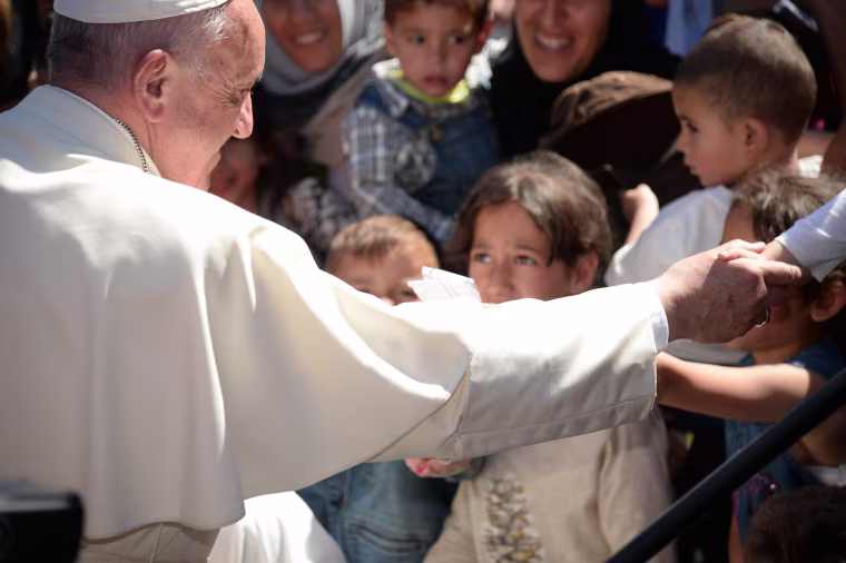 Image: Pope Francis greets migrants and refugees at the Moria refugee camp on Saturday.