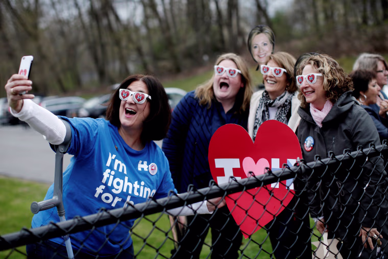 Image: Supporters of Democratic U.S. presidential candidate Hillary Clinton pose for a selfie photograph outside the Grafflin School where Clinton voted in the New York U.S. presidential primary election in Chappaqua