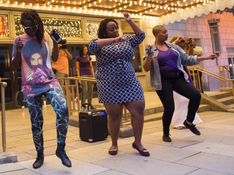 Image: People dance during a vigil in Washington, D.C.