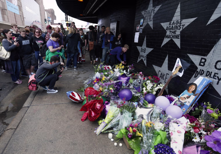 Image: Fans gather at a memorial at First Avenue Nightclub where the pop super star performed several times in his career