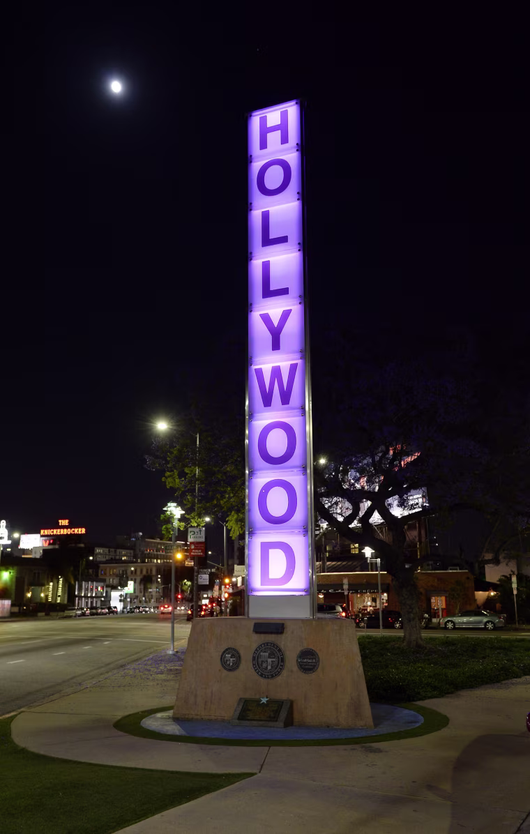 Image: A sign is illuminated in purple in memory of the late musician in Los Angeles, California