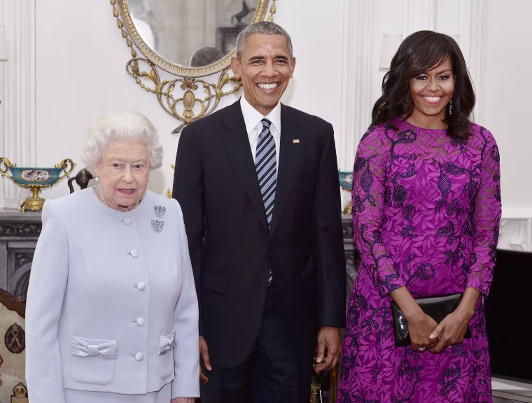 Image: Queen Elizabeth II (left) stands with the President and First Lady of the United States Barack Obama and his wife Michelle, in the Oak Room at Windsor Castle