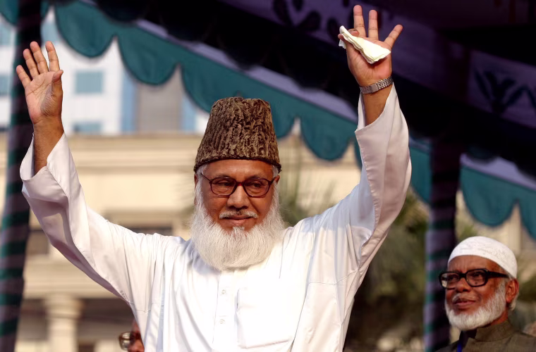 Image: Moulana Motiur Rahman Nizami, chief of the Jamaat-e-Islami, Bangladesh's biggest Islamic Political Party and an alliance of the ruling Bangladesh Nationalist Party, waves to his supporters during a rally in Dhaka