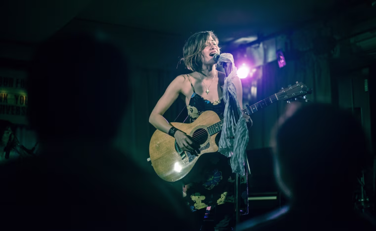 Kat McDowell, who busked in Japan to promote her music, performing.
