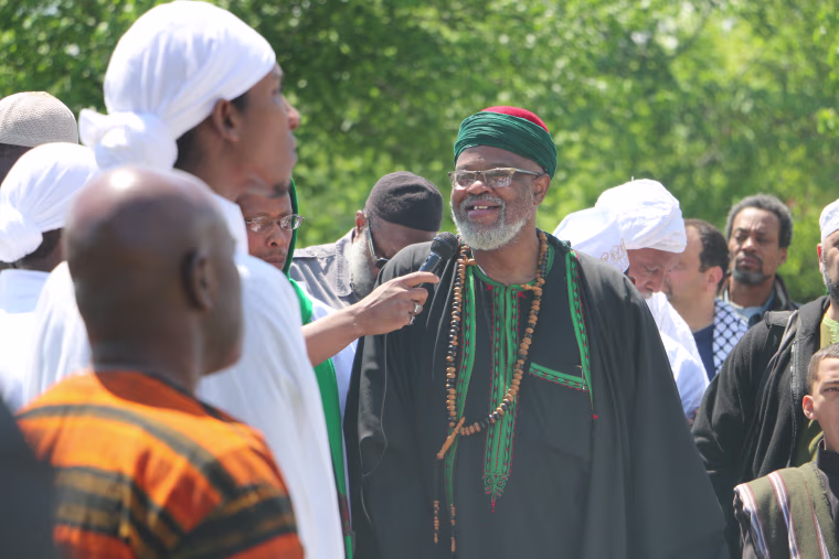Imam Al-Hajj Talib 'Abdur-Rashid delivers a prayer and reflections to several hundreds of people who came to Ferncliff Cemetery in Hartsdale, New York, to honor Malcolm X on his birthday.