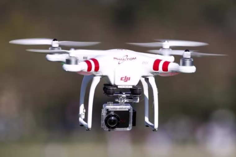 A Phantom drone by DJI company, equipped with a camera, flies during the 4th Intergalactic Meeting of Phantom's Pilots in an open secure area in the Bois de Boulogne, western Paris
