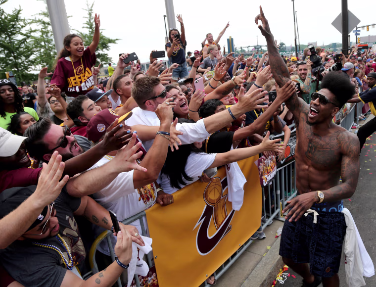 Image: Cleveland Cavaliers Iman Shumpert celebrates with the crowd in downtown Cleveland