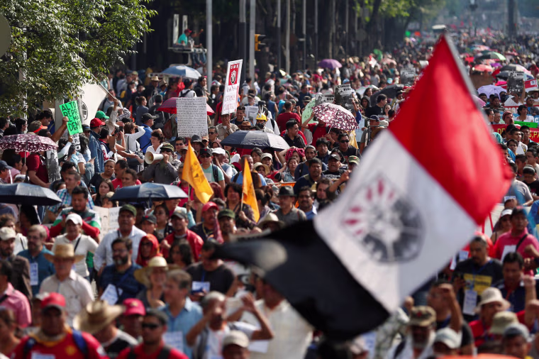 Image: Protesters from the National Coordination of Education Workers (CNTE) teachers' union march against President Enrique Pena Nieto's education reform, along the streets in Mexico City